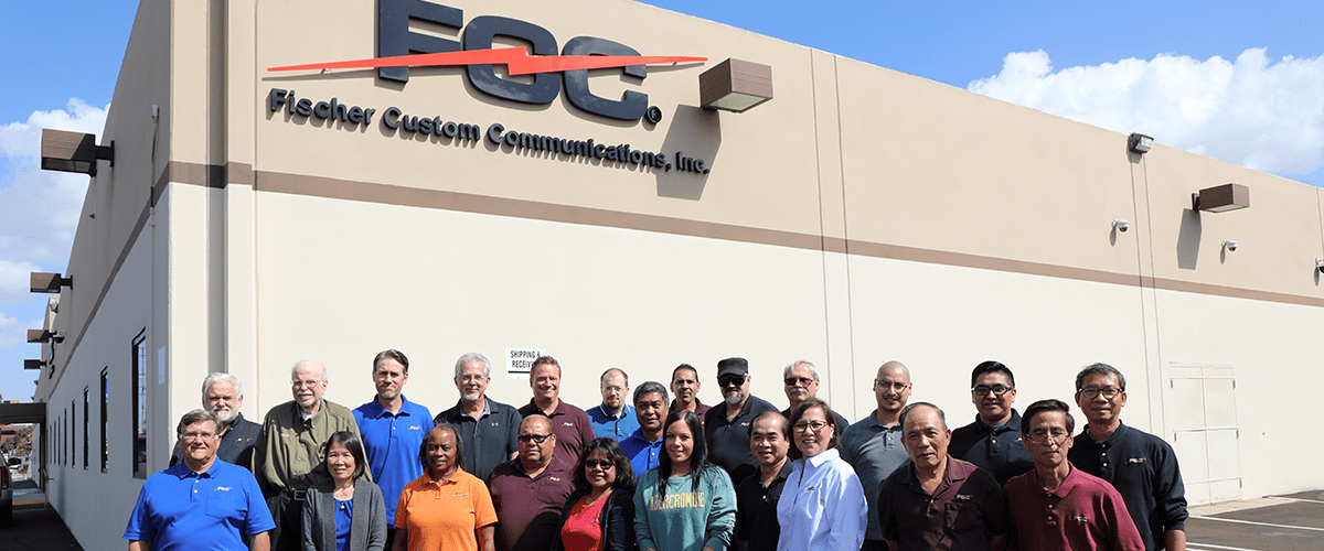 Group of employees gathered outside of warehouse