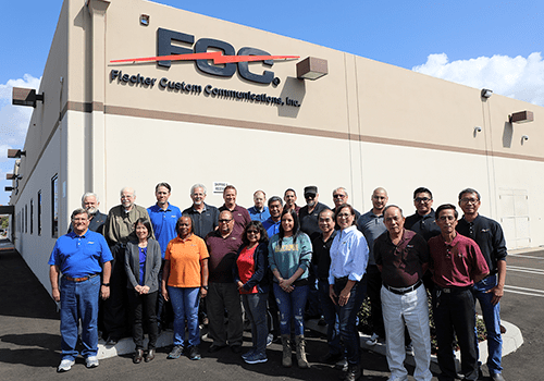 Group of employees gathered outside of warehouse