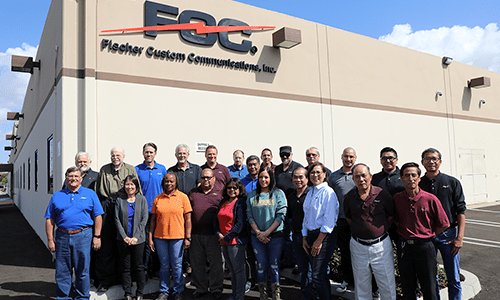 Group of employees gathered outside of warehouse