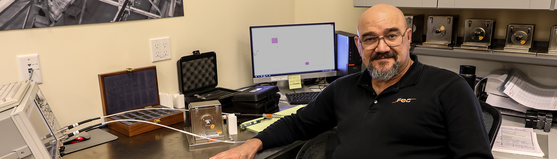 Technician at working desk.