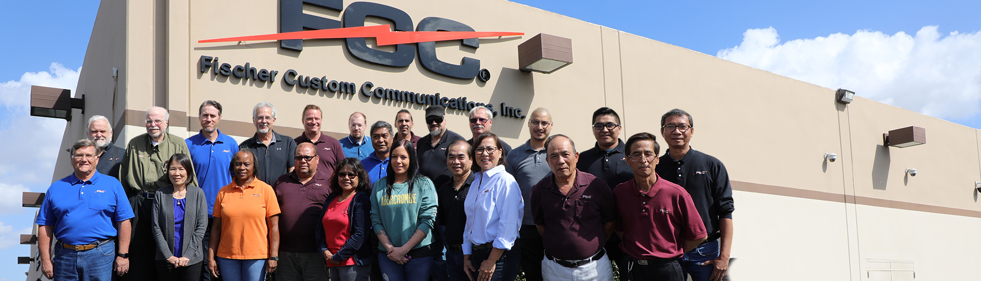 Group of employees gathered outside of warehouse