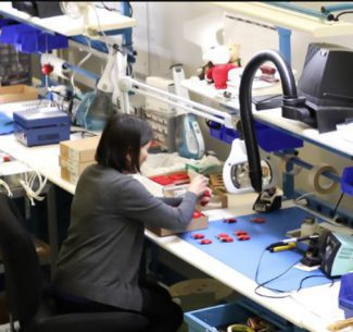 Technician at work table, building project.